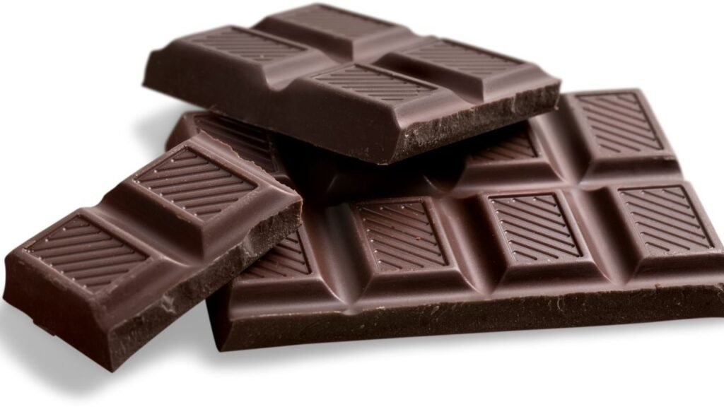 Chocolate, which contains theobromine and is toxic to dogs, affecting their heart and nervous system.