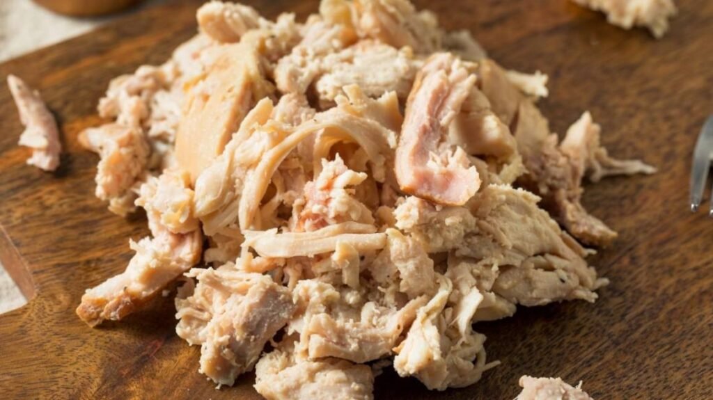 Cooked chicken (unseasoned and boneless) as a lean protein source for dogs.