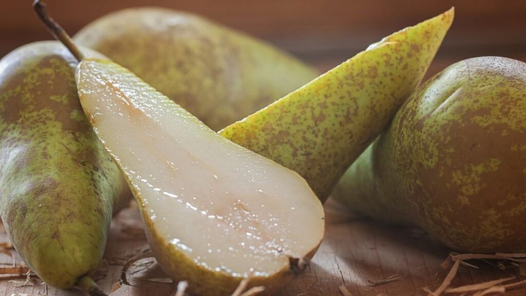 Seedless pears (in moderation) that are fiber and vitamin C-rich, supporting digestion in dogs.